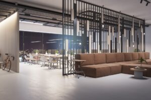 A modern office lobby with a brown couch and high ceilings
