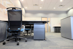 Office with new modern furniture including desks, cupboards, filing cabinets and chairs.