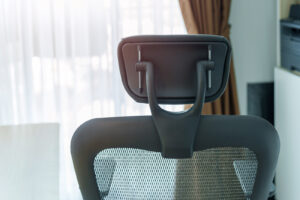 Black office chair with mesh back and headrest